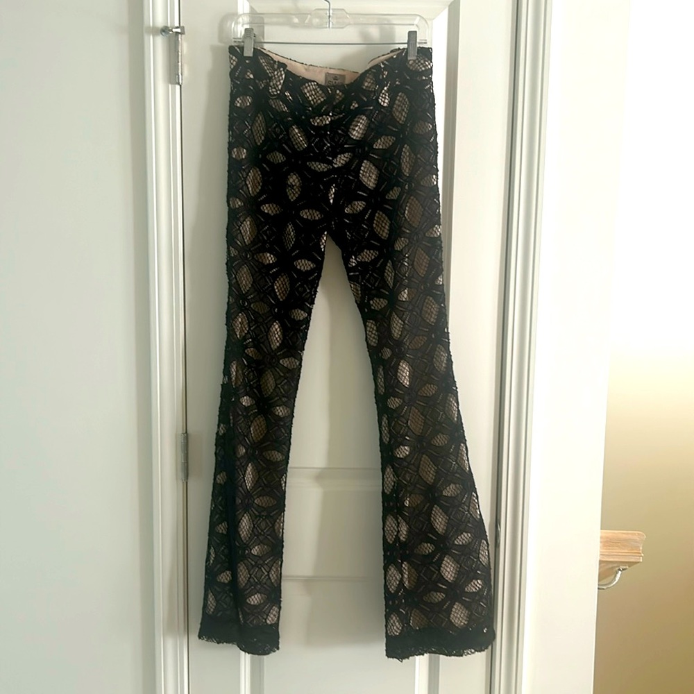 Black lace, lined, low rise pants.